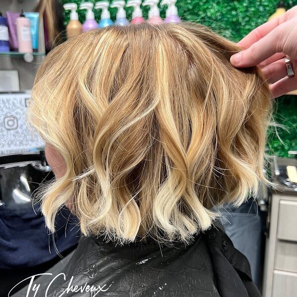 Blended Root Smudge Bob - a woman wearing black cape.