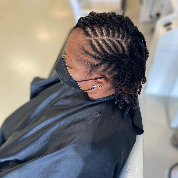 Braided Kinky Twist Hairstyle - a woman wearing black mask and cape.