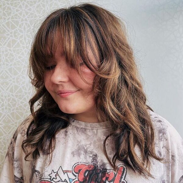 Cute Wispy Fringe for Chubby Faces - a woman wearing dyed shirt.