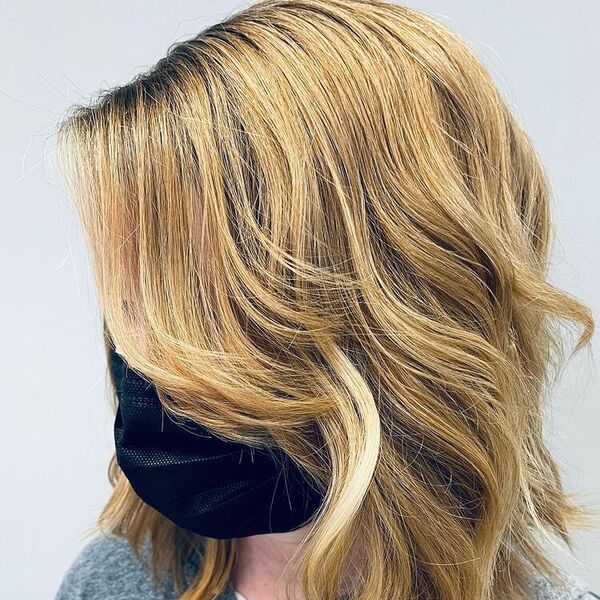 Face Framing Curly Side Bangs - a woman wearing black mask and gray shirt.