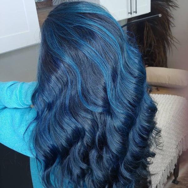 Alternating Black Blue Hair - a woman wearing sky blue jacket.