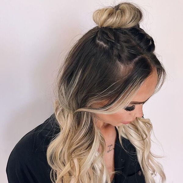 Boho Top Knot Hairstyle - a woman wearing black polo.