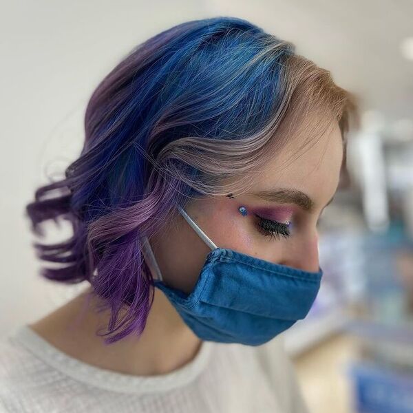 Chin Length Cool Tone Blue Purple Hair - a woman wearing blue mask in white top.