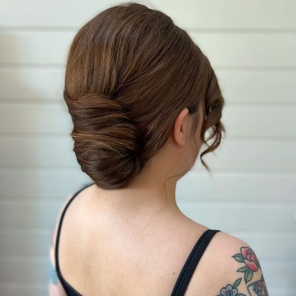 Classic Updo - a woman with tattoo wearing a black spaghetti strap