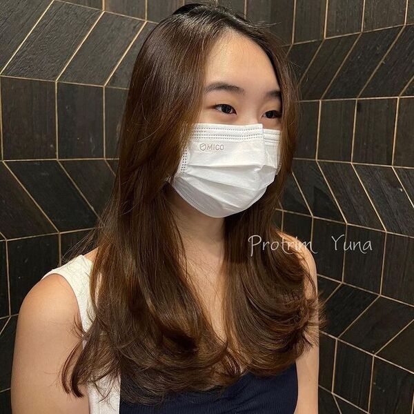 Cool Tone Bouncy Feather Hair - a woman wearing mask in black tank top.