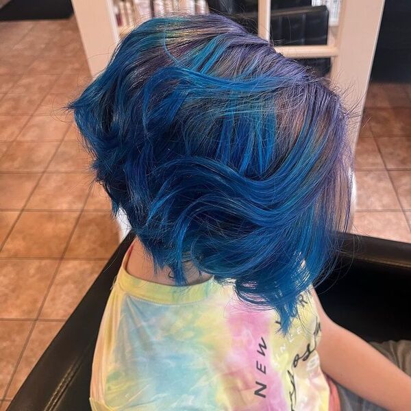 Dark Tone Purple and Blue Undercut - a woman wearing colorful dyed shirt.