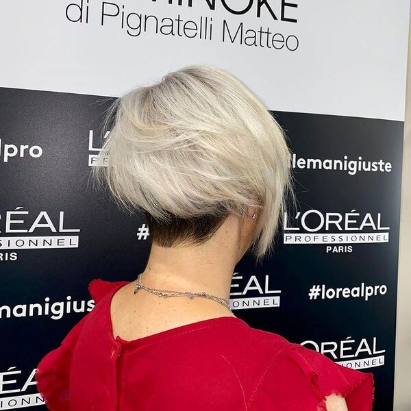 Edgy Cut with Black Base and Platinum Rest - a woman wearing a red blouse