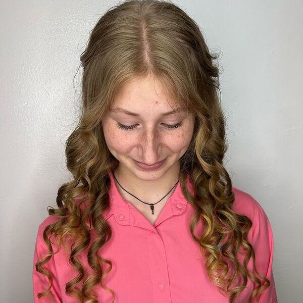 Formal Curly Long Hairstyle - a woman wearing a pink longsleeve blouse