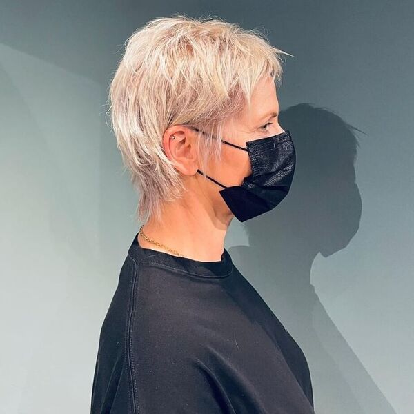 Ice Blonde Hair - a woman wearing black facemask