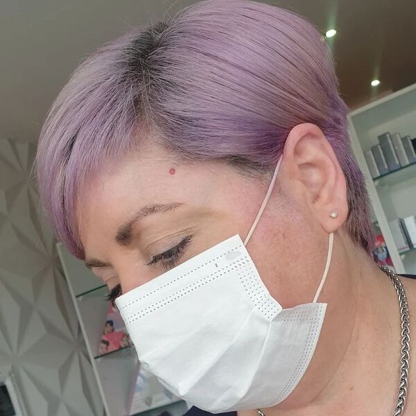 Pixie Cut with Dusty Lavander Color - a woman wearing white facemask