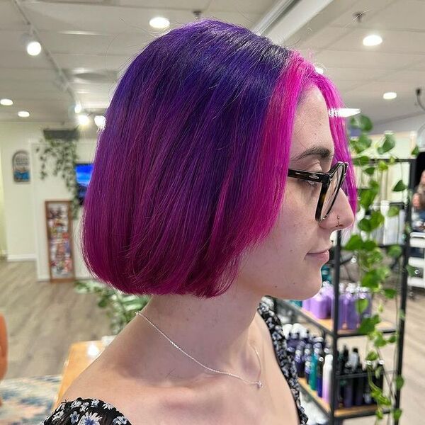 Purple Pink Direct Cut Bob - a woman wearing floral black top.