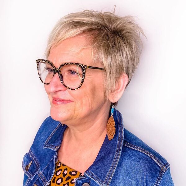 Short Stack - a woman wearing glasses in denim jacket.