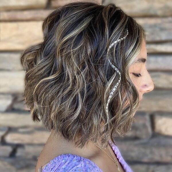 Wavy Bob with Feather Streaks - a woman wearing purple floral puff sleeves.