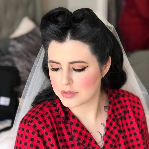 Wedding Roll Pin up Hairstyle - a woman wearing red checkered polo.