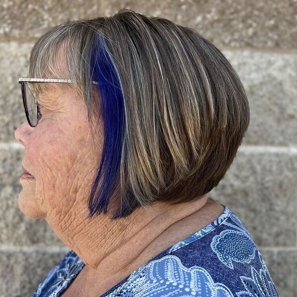 Wedge Cut with Pop of Color - a woman wearing blue printed top with glasses